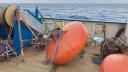 Orange buoy on deck of RV Pelagia, waiting to be deployed